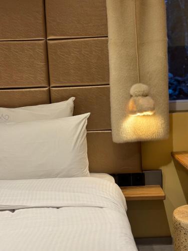 Ένα ή περισσότερα κρεβάτια σε δωμάτιο στο Les Secrets - Suites & Apartments