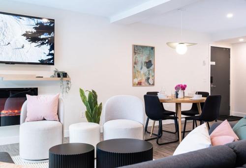 a living room with a table and chairs at Powder Village Retreat by Revelstoke Vacations in Revelstoke