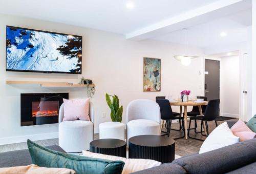 a living room with a couch and a table at Powder Village Retreat by Revelstoke Vacations in Revelstoke