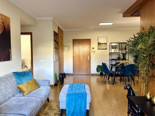 a living room with a couch and a table at Turquesa in Funchal