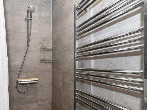 a shower in a bathroom with stainless steel at Holiday home Thyborøn VI in Thyborøn