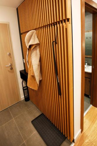a room with a refrigerator with a towel on it at UrbanKop Vidik Residence in Kopaonik