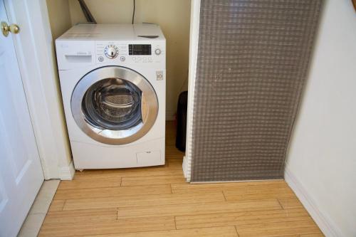 a washer and dryer sitting in a hallway at BrightonBeach-Comfy Room-Close Ocean in Brooklyn