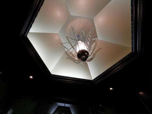 a ceiling with a chandelier in a room at Hotel Monterey Kyoto in Kyoto
