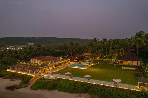 an aerial view of a resort with a swimming pool at La Cabana Beach & Spa, By Ashvem Beach in Mandrem