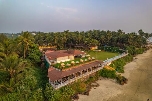 an aerial view of a house on the beach at La Cabana Beach & Spa, By Ashvem Beach in Mandrem