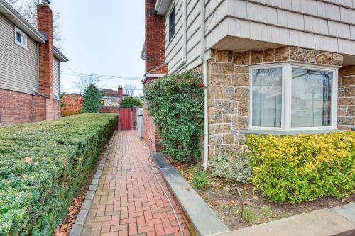 a brick sidewalk in front of a house at Cozy Valley Stream Studio, 20 Mi to Times Square! in Laurelton