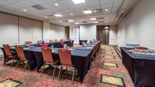 a conference room with a long table and chairs at Hilton Garden Inn Denver Airport in Aurora