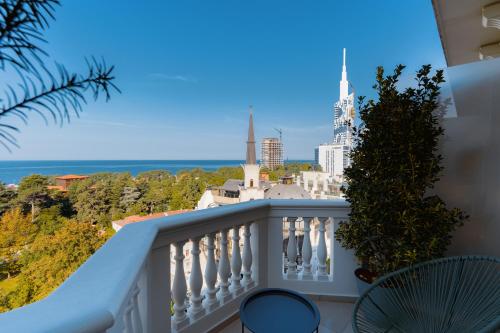 a balcony with a view of the ocean at Tapis Rouge Design Boutique Hotel in Batumi