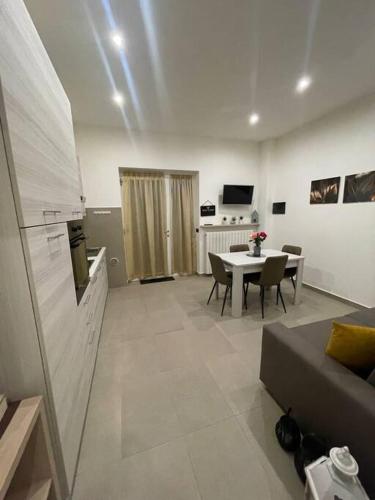 a living room with a table and a couch at Apartment near Como and Milan with private garage in Mozzate
