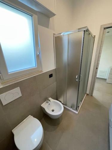 a bathroom with a shower and a toilet and a sink at Apartment near Como and Milan with private garage in Mozzate