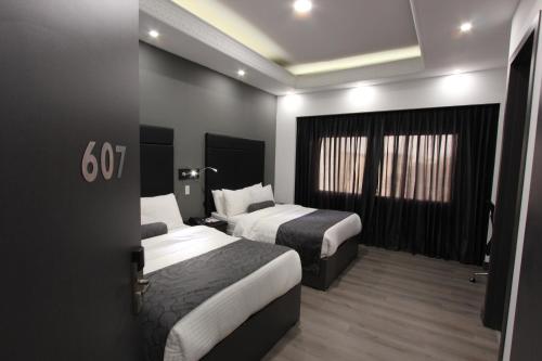 Una cama o camas en una habitación de Hotel San Fernando Real