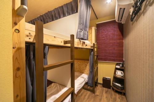 a bunk bed room with two bunk beds in it at IKIDANE Cozy Hotel Haneda Airport - Vacation STAY 25827v in Tokyo