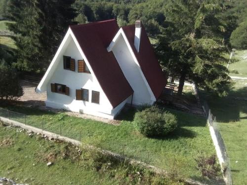 an aerial view of a white house with a red roof at Chalet Edelweiss Marsia-Tagliacozzo 1500mt in Marsia