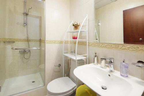 a bathroom with a sink and a toilet and a shower at Sunny Seaside 2 Bedroom Apartment, Dubai Marina in Dubai