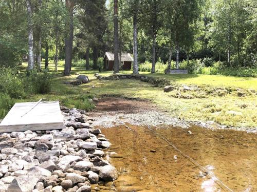 a pile of rocks next to a stream at 6 person holiday home in RÄTTVIK-By Traum in Rättvik