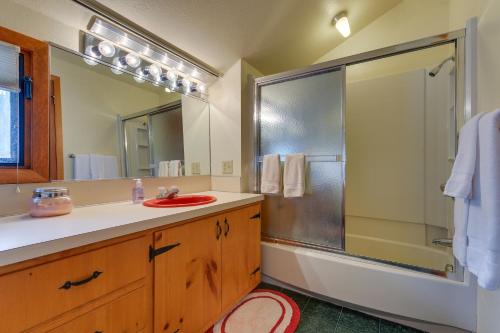 a bathroom with a shower and a sink and a mirror at Lush Lander Apartment with Sunroom, Sauna and Grill! in Lander