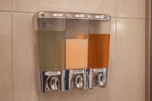 a bunch of different colored items in a wall at Jet Luxury Elite at The Signature in Las Vegas