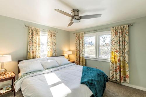 a bedroom with a bed and a ceiling fan at The Loft at Hebron Valley Overlook in Madison