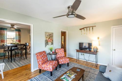 a living room with a couch and chairs and a table at The Loft at Hebron Valley Overlook in Madison