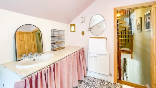 a bathroom with a sink and a mirror at 3-bed Hidden Gem Of A Cottage In Margate in Margate