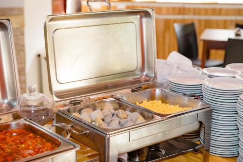 a buffet with dishes of food on a table at Hotel Casa Blanca Porto Seguro in Porto Seguro