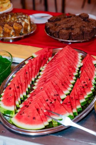 a plate of watermelon slices on a table at Hotel Casa Blanca Porto Seguro in Porto Seguro