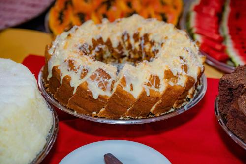a cake sitting on top of a table at Hotel Casa Blanca Porto Seguro in Porto Seguro