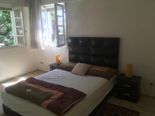 Postel nebo postele na pokoji v ubytování DUPLEX VILLA RESIDENCE LA CORNICHE juste à coté de la plage