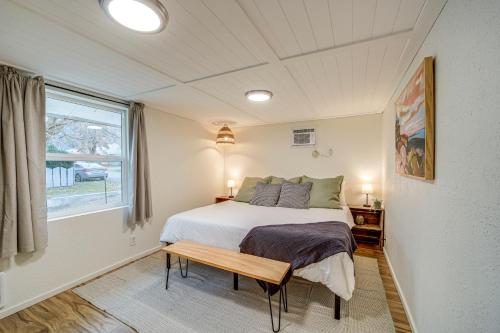 a bedroom with a bed and a window at Cozy Grand Coulee Home with Deck and Views! in Grand Coulee
