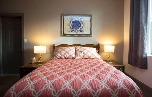a bedroom with a large red bed with two lamps at Dodici Night Suites in Washington
