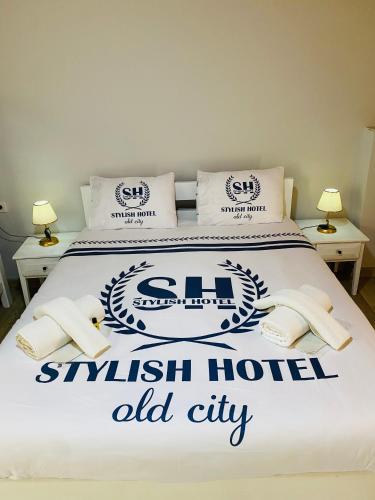 a bed with a sign for a swiss hotel old city at Stylish Hotel Old City in Istanbul