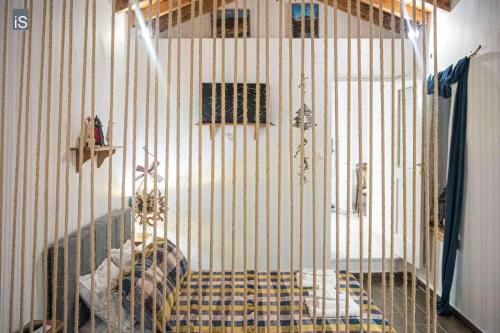 a room with a cage with a bed in it at MY HOME in Áno Lekhónia