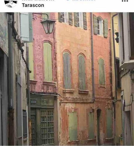 an old building on a street in a city at Appartement PROUDHON in Tarascon