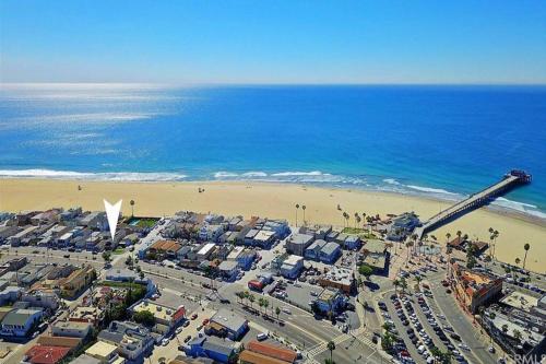 an aerial view of a beach with a crane at Steps from the Sand-Rooftop Spa-Incredible Views in Newport Beach