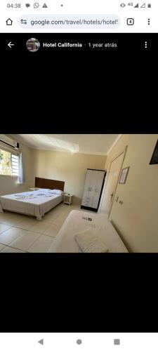 uma fotografia de um quarto com uma cama num quarto em Hotel California em Goiânia