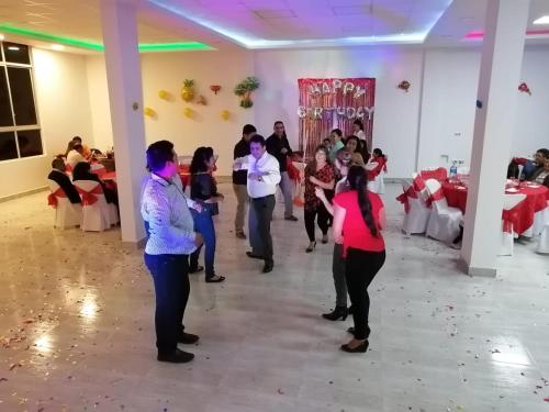 a group of people dancing at a party at Hotel Angostura in Cochabamba