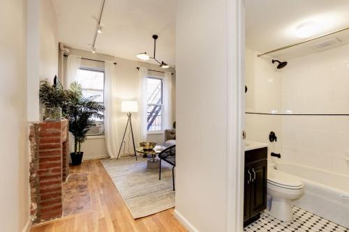 a bathroom with a toilet and a bath tub at Apartment 129: Upper East Side in New York