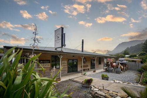 a building with a sign in front of it at Punakaiki Rocks Hotel & Garden Bar in Punakaiki
