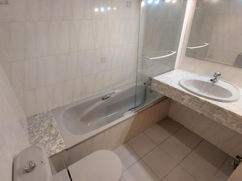 a bathroom with a shower and a sink and a toilet at Apartamento Llançà, 2 dormitorios, 5 personas - ES-170-34 in Llança
