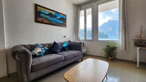 a living room with a couch and a table at San Pedro Suite in San Pedro La Laguna