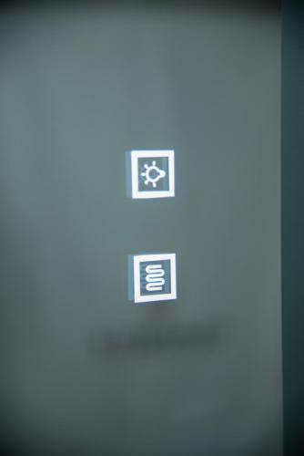 a close up of a computer screen with four stickers on it at Serenity by Elite Dwellings in Portariá