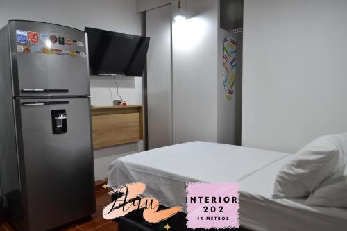 Una cama o camas en una habitación de Apartaestudio en Envigado