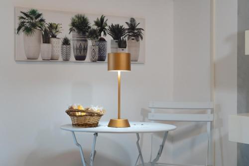 a table with a lamp on top of it at Relax room Apartment in Rome