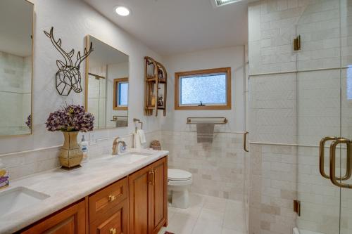 a bathroom with a shower and a sink and a toilet at Close to Trails Family-Friendly Stateline Home! in Stateline