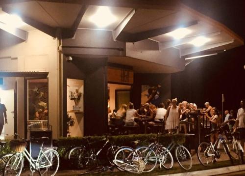 a group of bikes parked outside of a restaurant at night at Stylish Family Beach House - 200m to the Beach in Mudjimba
