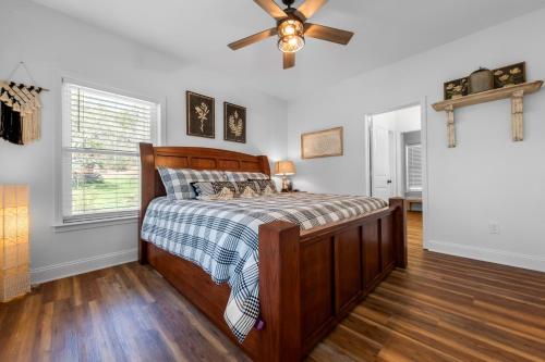 a bedroom with a bed and a ceiling fan at Charming Murphy House with Deck and River Views! in Murphy
