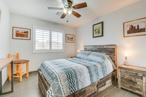 a bedroom with a bed and a ceiling fan at Golf, Hike and Bike Townhome in Fountain Hills! in Fountain Hills