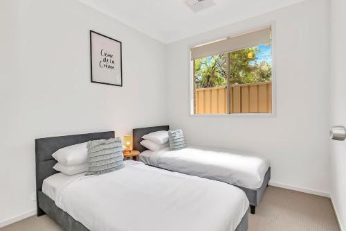 Postel nebo postele na pokoji v ubytování Opie's Oasis between West Beach & Henley South