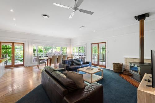 a living room with a couch and a table at Magical Lucindale - Gorgeous 4 Bedroom House in Lucaston